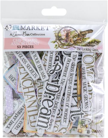 Front view of 49 & Market "The Looking Glass" chipboard assortment in clear retail packaging. Visible pieces include heavy-weight chipboard words "Enchanted" and "Dream," a vintage fountain pen illustration, and whimsical fairy artwork by Joanne Bain.