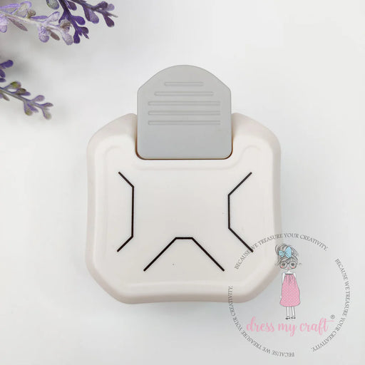 A top-down view of the cream and gray Dress My Craft 3-in-1 Angle Punch, showing the three marked angle size slots and the large ergonomic press lever.