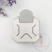 A top-down view of the cream and gray Dress My Craft 3-in-1 Angle Punch, showing the three marked angle size slots and the large ergonomic press lever.