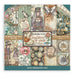 Stamperia Gardens of Time 12x12 inch paper pad cover by Antonis Tzanidakis, showcasing steampunk characters, vintage clocks, steam trains, and pink flowers.